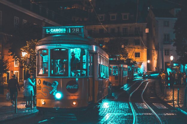 photo of people riding on city tram